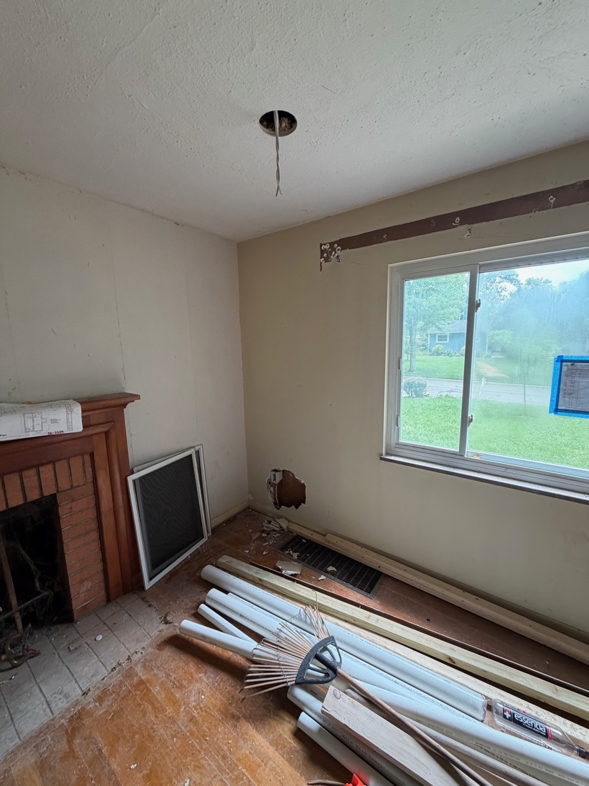Room corner with fireplace and window